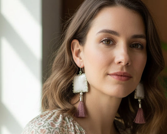 Woman wearing handmade square tassel earrings, Asimico Handmade Jewellery style